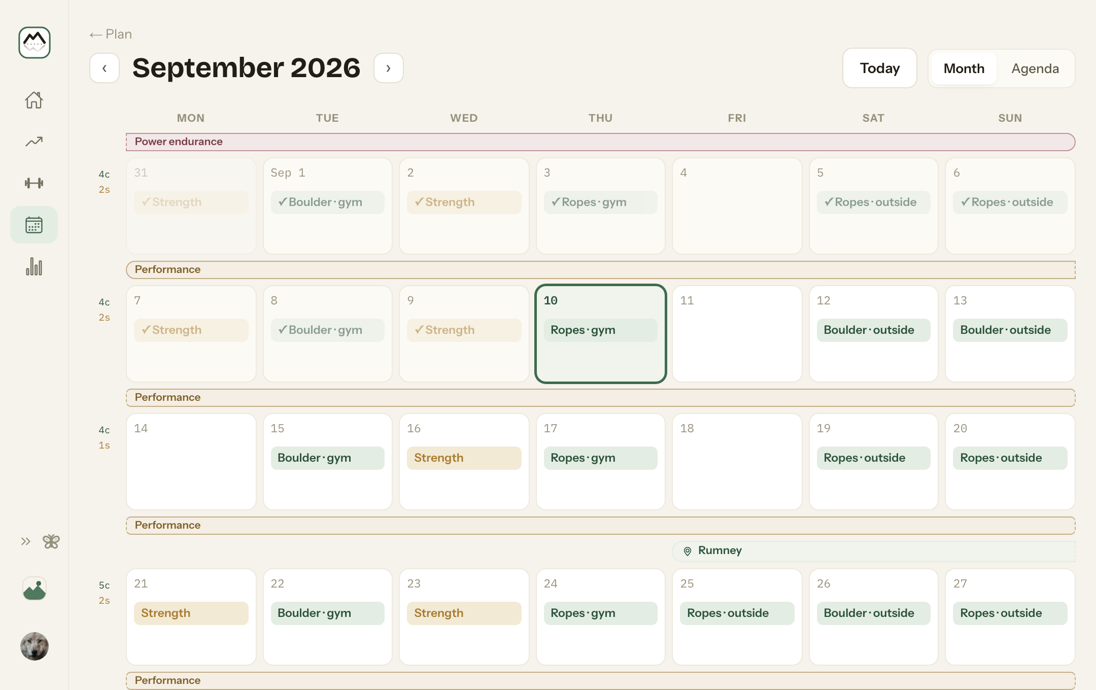 The calendar for September: a training phase running across each week, a trip to Rumney marked over its days, climbing and strength days on their dates, and a tick on each one already logged