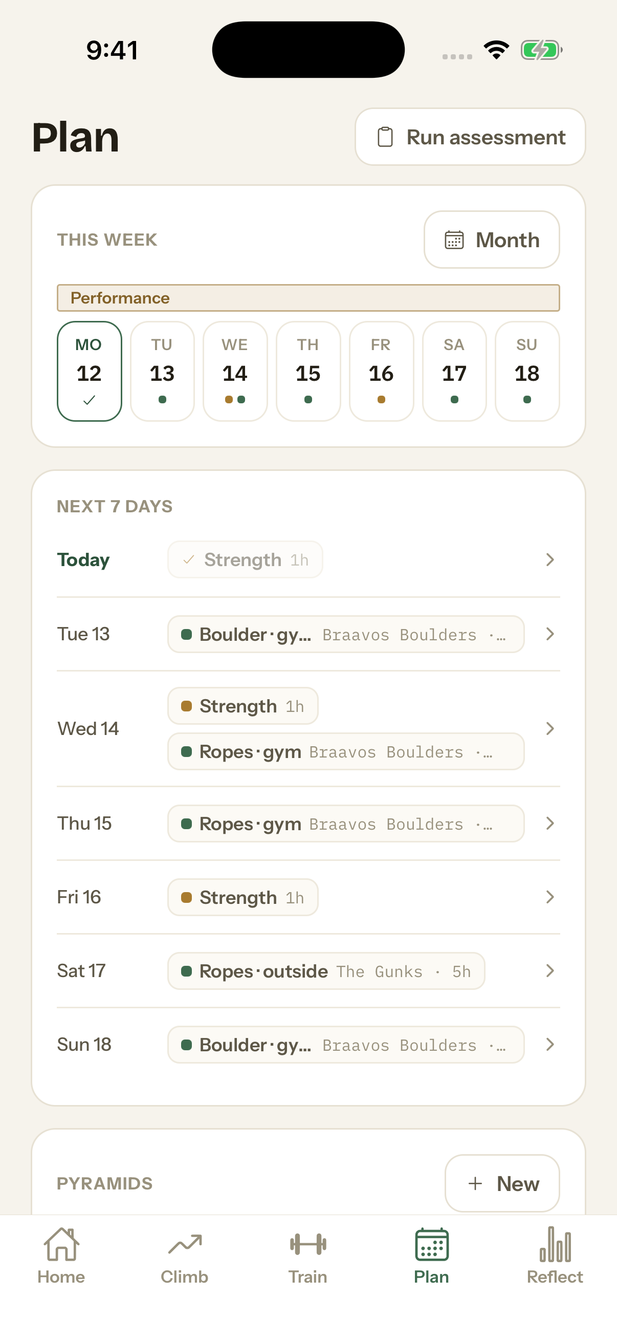 The phone app's Plan tab: this week under a training phase, then the next seven days with a climbing or strength day on each